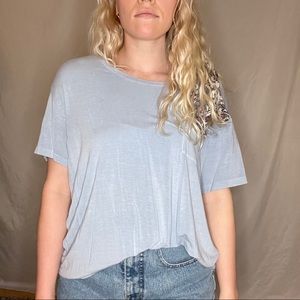 Light blue t-shirt, small white spot on front